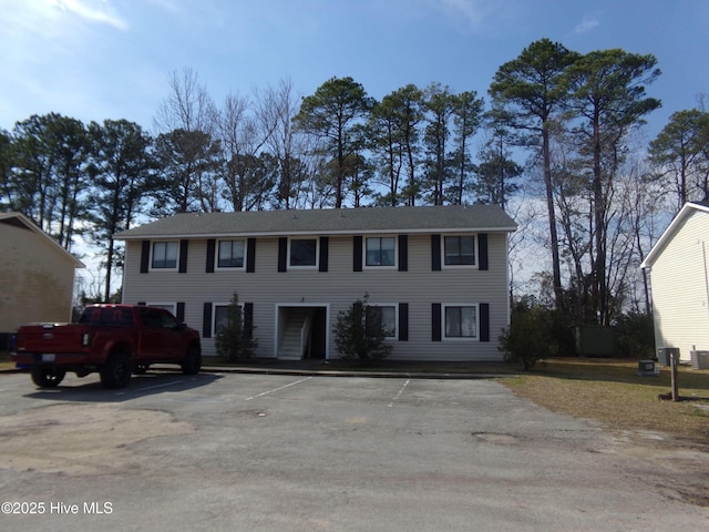 colonial inspired home with uncovered parking