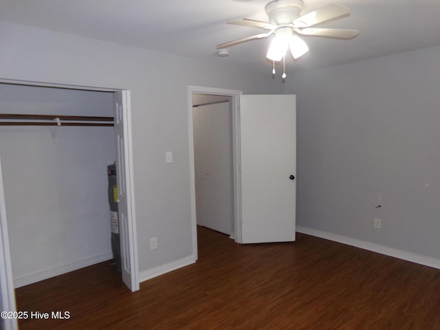 unfurnished bedroom featuring ceiling fan, baseboards, and wood finished floors