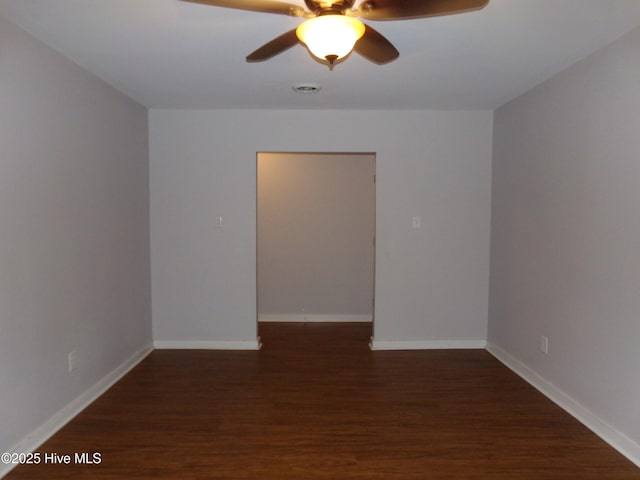 spare room with ceiling fan, baseboards, and wood finished floors