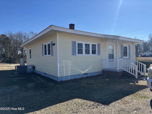 view of front of property with a chimney and crawl space