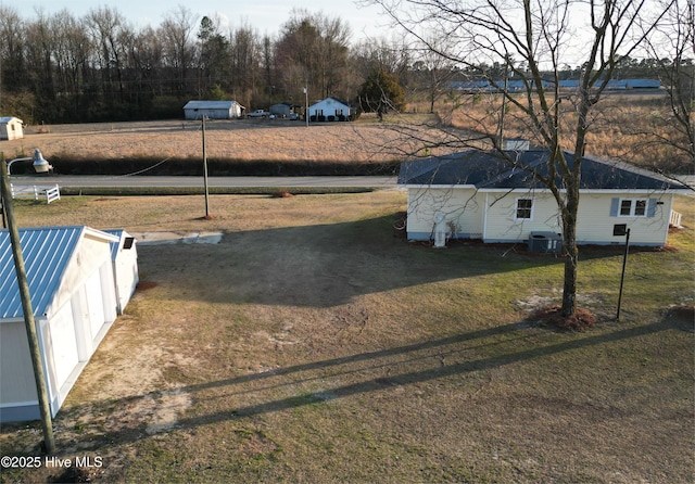 view of yard with central AC