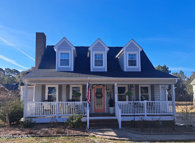 view of front of property with covered porch and a chimney