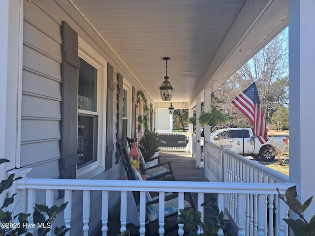 wooden terrace featuring a porch