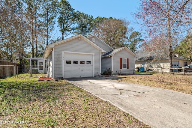 single story home featuring driveway, a front lawn, an attached garage, and fence