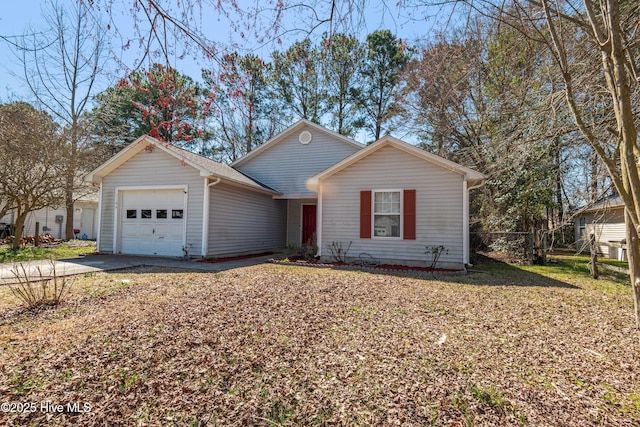 single story home with an attached garage and driveway