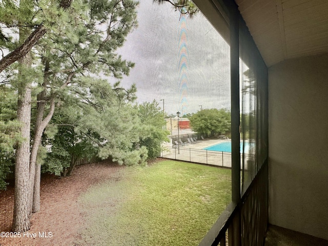 view of yard featuring a balcony