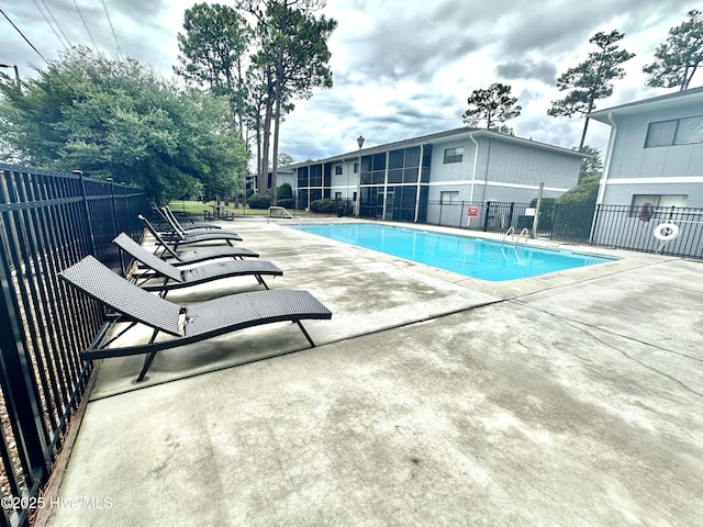 pool featuring a patio and fence