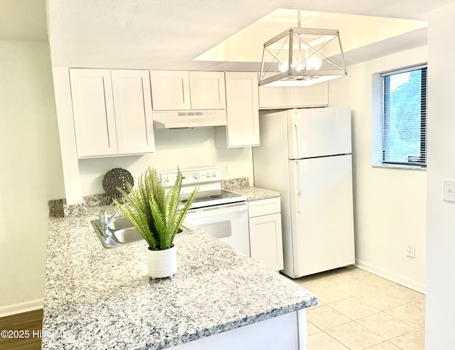 kitchen featuring under cabinet range hood, white appliances, white cabinets, and light stone countertops