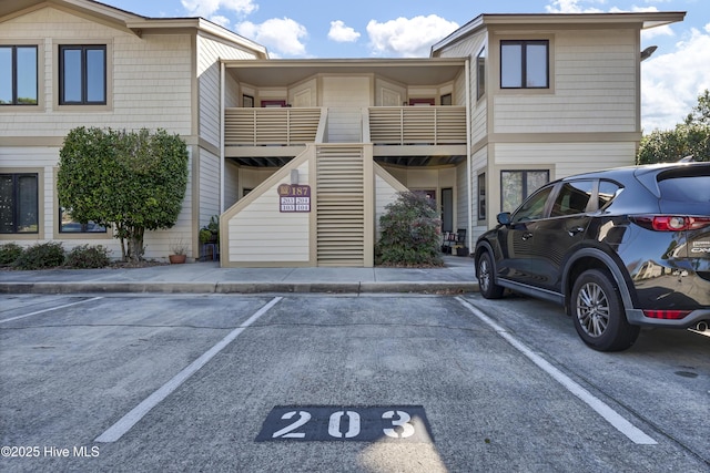 view of property with uncovered parking