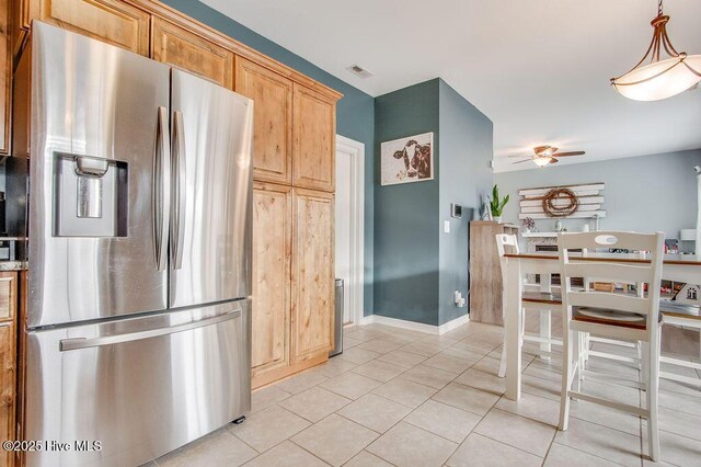 kitchen with visible vents, ceiling fan, baseboards, stainless steel refrigerator with ice dispenser, and light tile patterned flooring