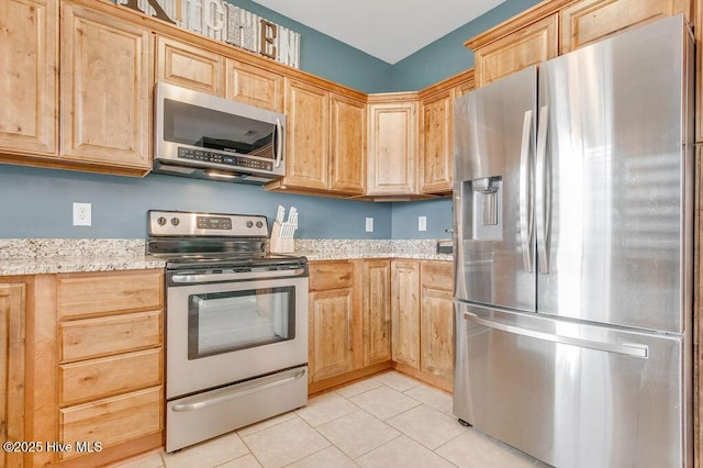 kitchen featuring appliances with stainless steel finishes and light brown cabinets