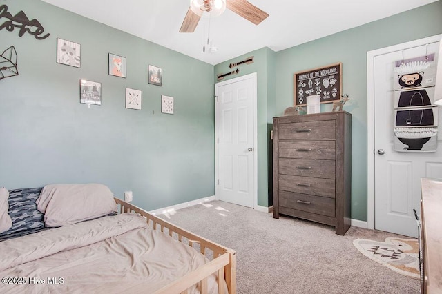 bedroom with baseboards, ceiling fan, and carpet flooring