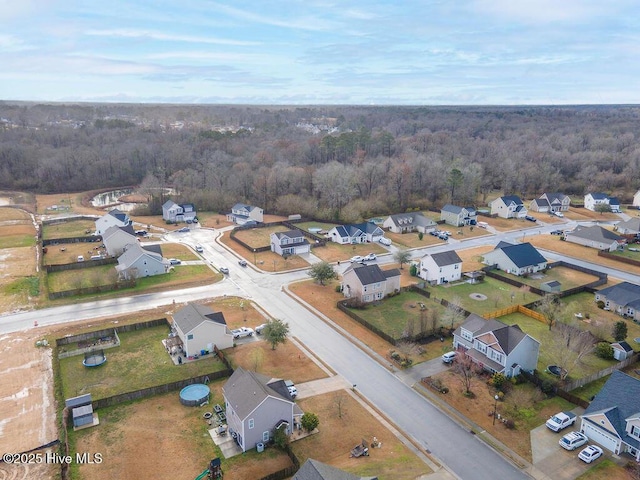 bird's eye view featuring a residential view and a view of trees