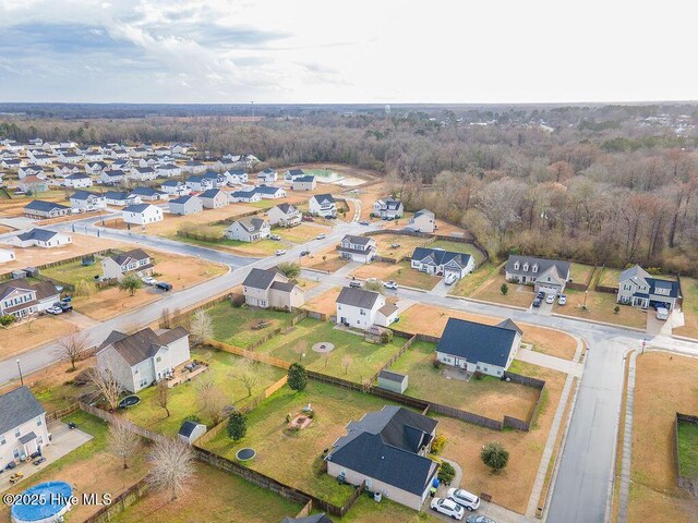 birds eye view of property with a residential view