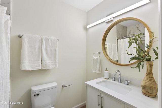 full bathroom featuring vanity and toilet