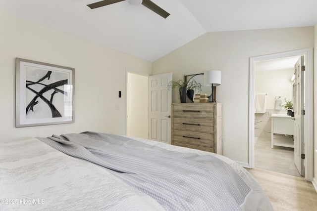 bedroom featuring vaulted ceiling, connected bathroom, light wood-type flooring, and ceiling fan