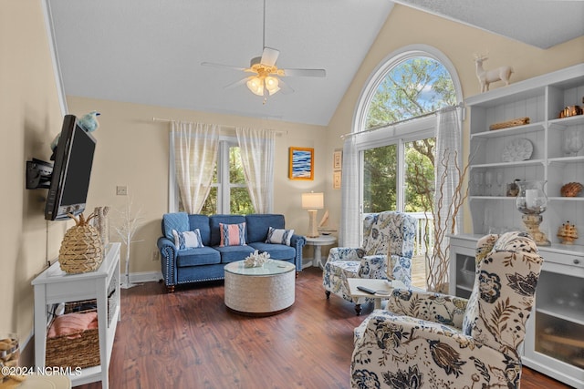 living room featuring a wealth of natural light, lofted ceiling, and wood finished floors