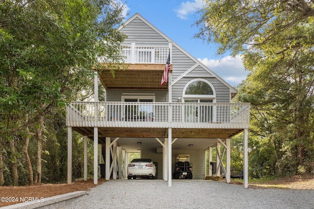 view of front of house featuring a carport and driveway