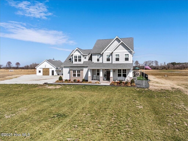 view of front of home with covered porch and a front yard