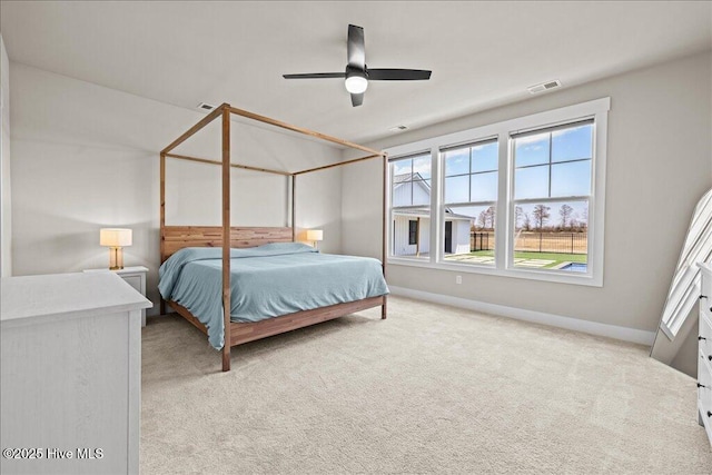 bedroom with visible vents, ceiling fan, baseboards, and carpet