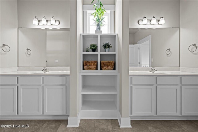 full bathroom featuring two vanities and a sink