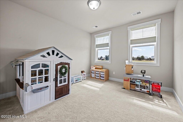 recreation room with visible vents, baseboards, and carpet floors