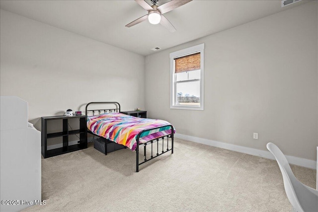 carpeted bedroom featuring a ceiling fan, baseboards, and visible vents