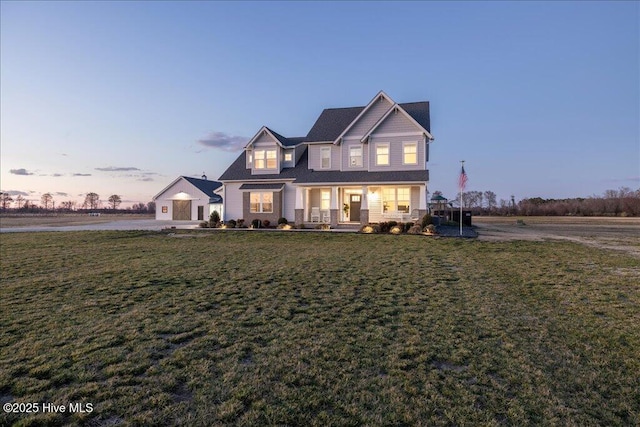 view of front of house with a yard