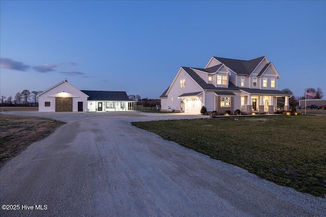 view of front facade with a lawn and driveway