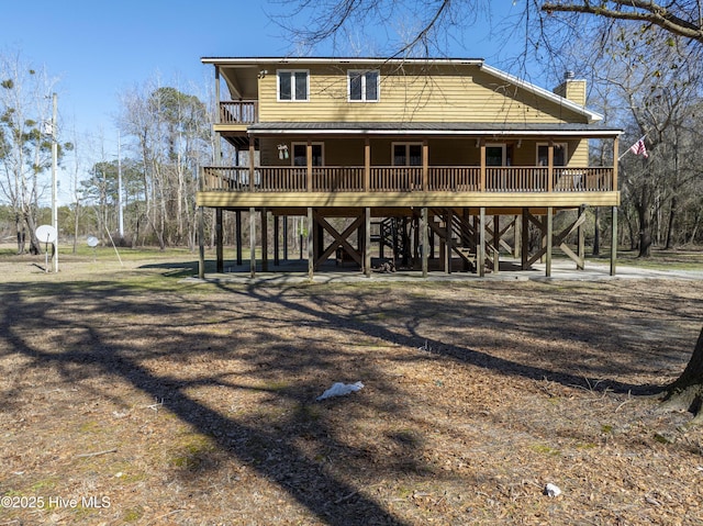 rear view of property with a chimney