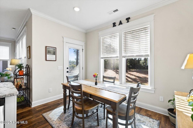 dining room featuring baseboards, visible vents, dark wood finished floors, recessed lighting, and crown molding