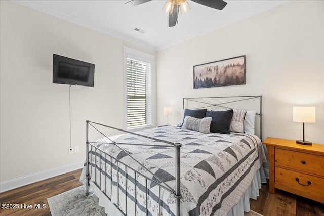 bedroom featuring visible vents, wood finished floors, crown molding, baseboards, and ceiling fan