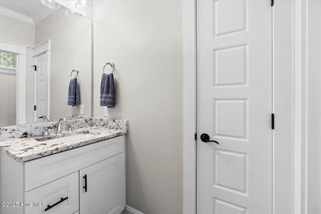 bathroom with vanity and crown molding