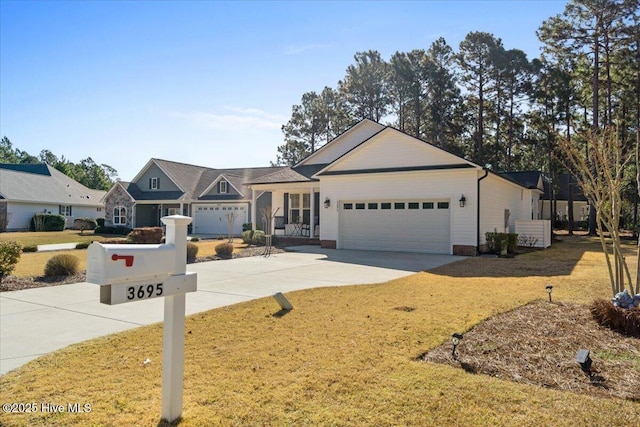 ranch-style home with a front yard, a garage, and driveway