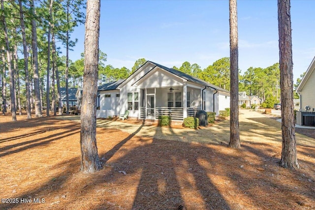 view of front of house with central air condition unit and ceiling fan