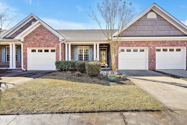 single story home with brick siding, an attached garage, driveway, and a front lawn