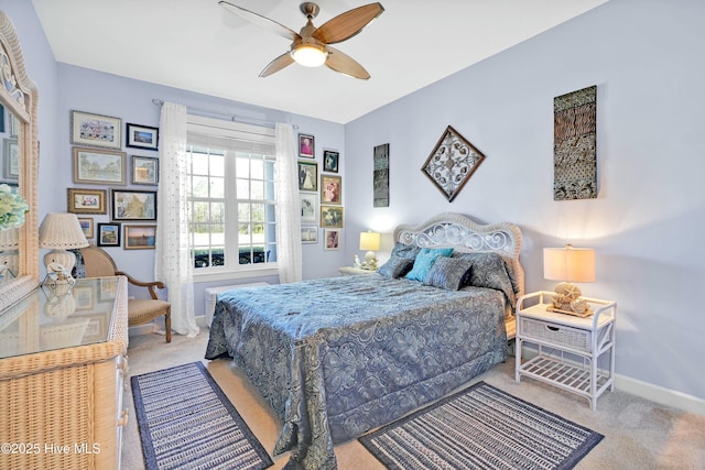 bedroom with baseboards, carpet, and a ceiling fan