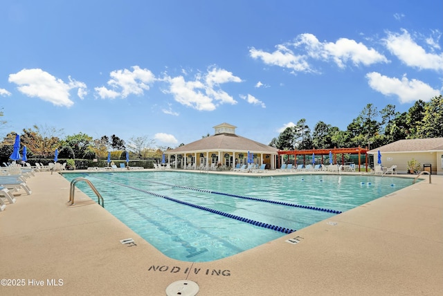 community pool featuring a patio and a pergola