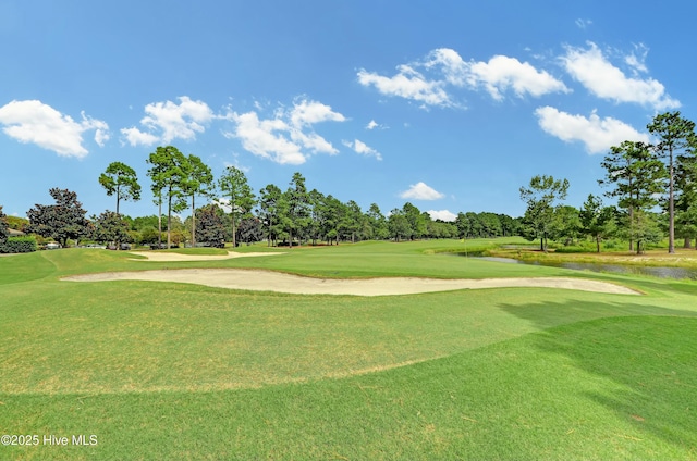 view of home's community with a yard and golf course view