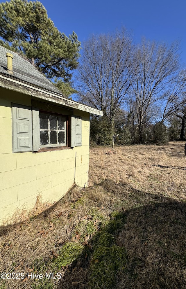 view of home's exterior with concrete block siding