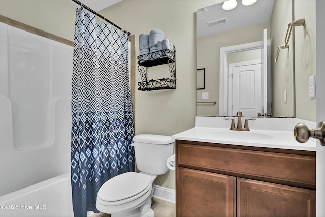 bathroom featuring vanity, toilet, shower / bath combo, and visible vents