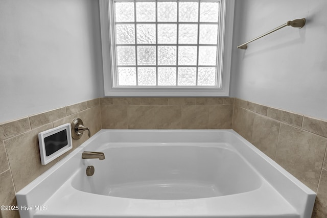 full bathroom with a garden tub