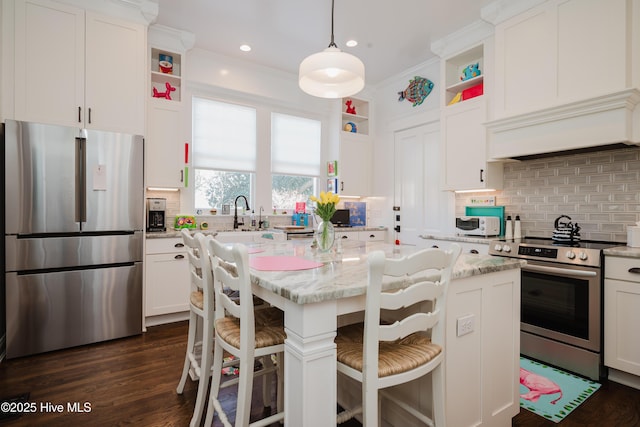 kitchen with crown molding, custom range hood, appliances with stainless steel finishes, white cabinets, and open shelves