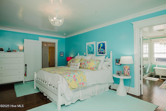 bedroom with visible vents, an inviting chandelier, wood finished floors, and crown molding