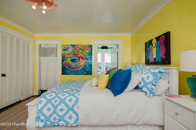 bedroom featuring wood finished floors and crown molding