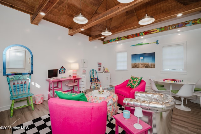 game room featuring wood finished floors, beamed ceiling, wood ceiling, and baseboards