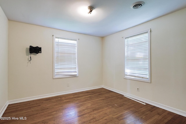 2209 Barnett Ave, Wilmington, NC 28403 - empty room with dark wood-type flooring and baseboards