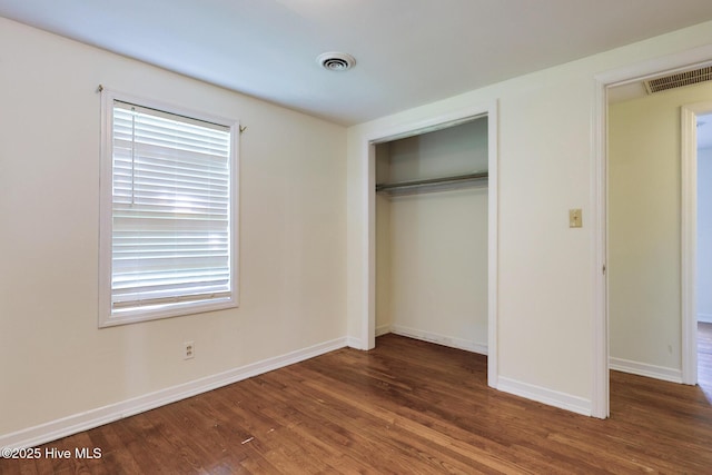 2209 Barnett Ave, Wilmington, NC 28403 - unfurnished bedroom with wood finished floors and a closet