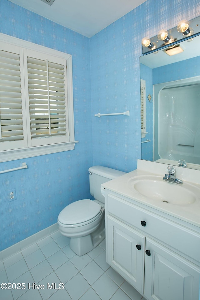 full bath with tile patterned floors, toilet, wallpapered walls, and vanity