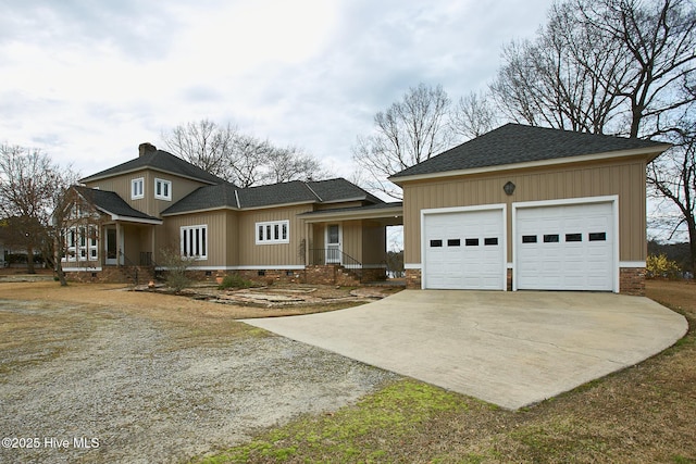 view of front of home with a shingled roof, concrete driveway, an attached garage, and crawl space